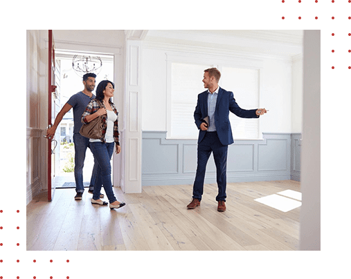 A group of people standing in a room.