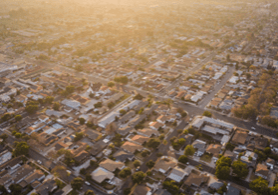 An aerial view of a city with lots of houses.